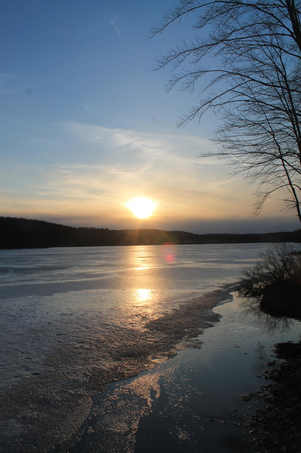 Setting Sun Over Frozen Lake