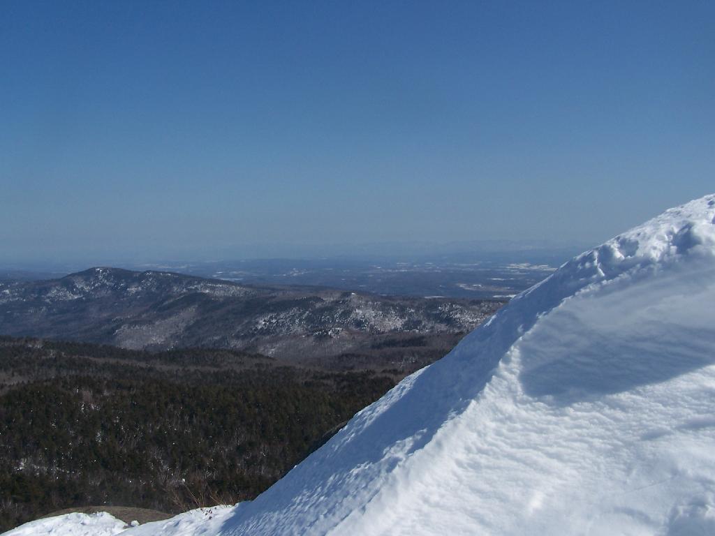 Photo: Snow Drift Against Mountain Background