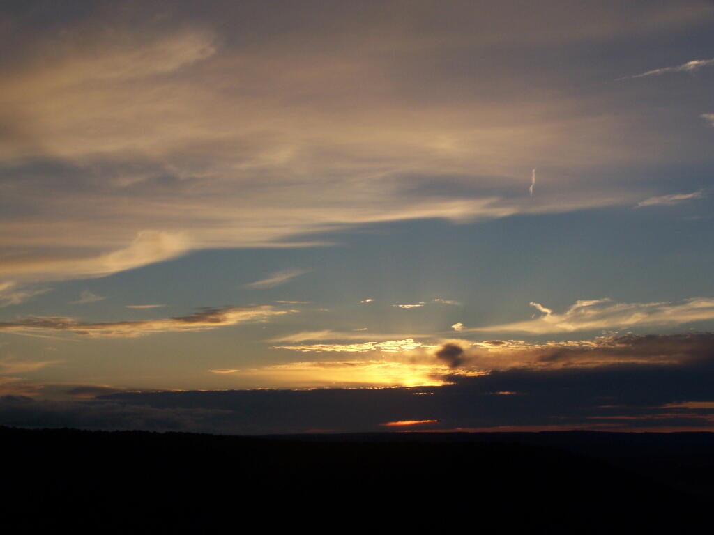 Photo: Sunsets Into Clouds