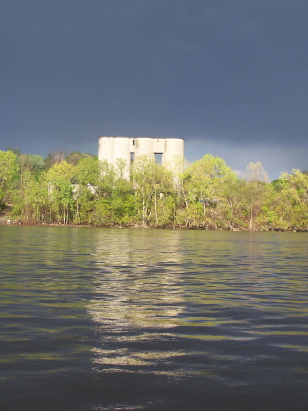 Photo: Back-Lit Abandoned Cement Silos