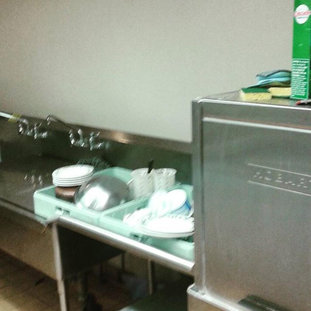 Photo: Washing dishes. One of many jobs.