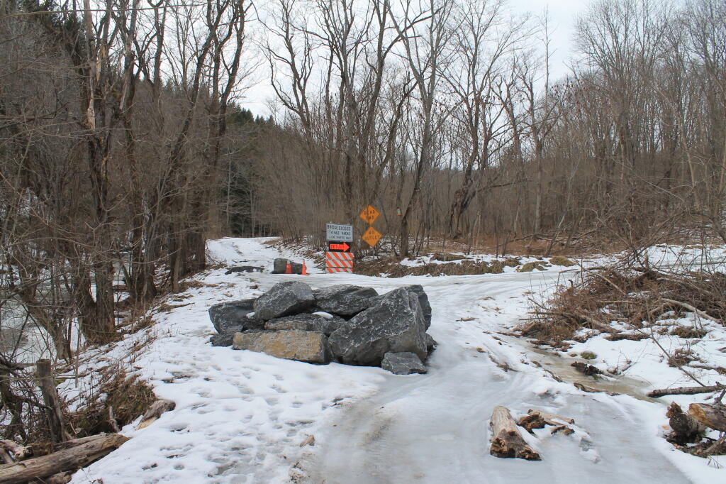 Photo: Baricade on Badly Eroded Road