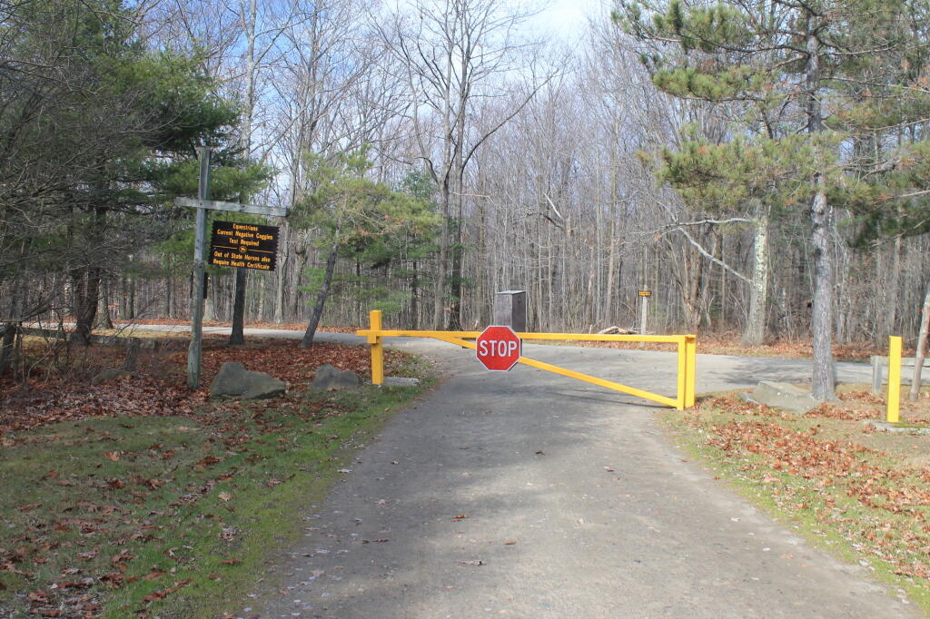 Photo: Forest Ranger Closed the Gate for the Season