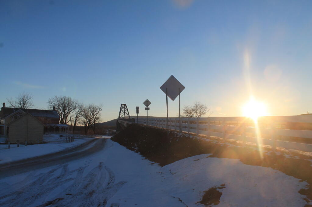 Photo: Setting Sun Over Bridge from Chimney Point