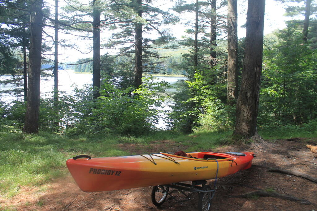 Photo: Strapping Down Kayak for Portage Back to Truck