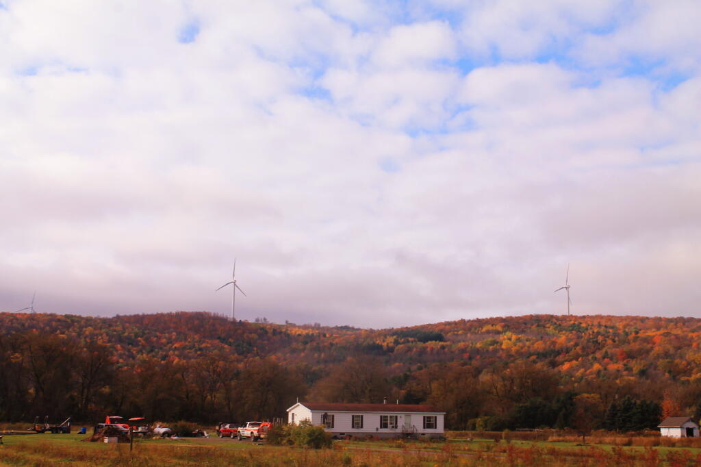 Photo: Wind Turbines and a Double Wide